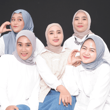 Group of 2 women posing with thumbs up and fun expressions