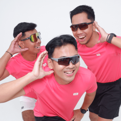 3 men wearing pink t-shirts and sunglasses posing cheerfully