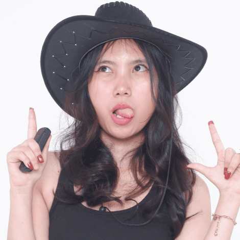 Group of 4 women wearing colorful clothes and sunglasses posing fun